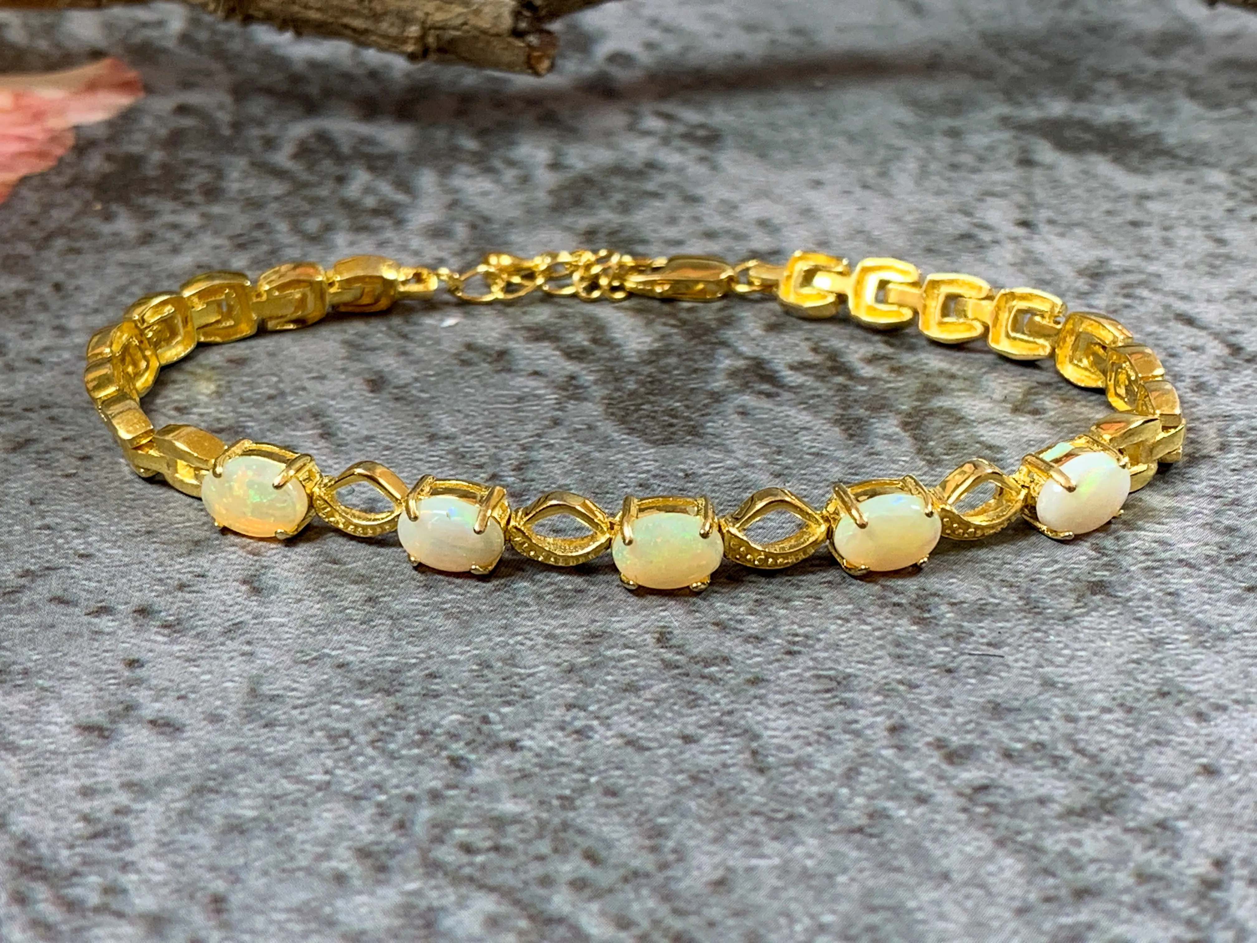 Gold Plated Sterling Silver patterned bracelet with 7x5mm White Opals