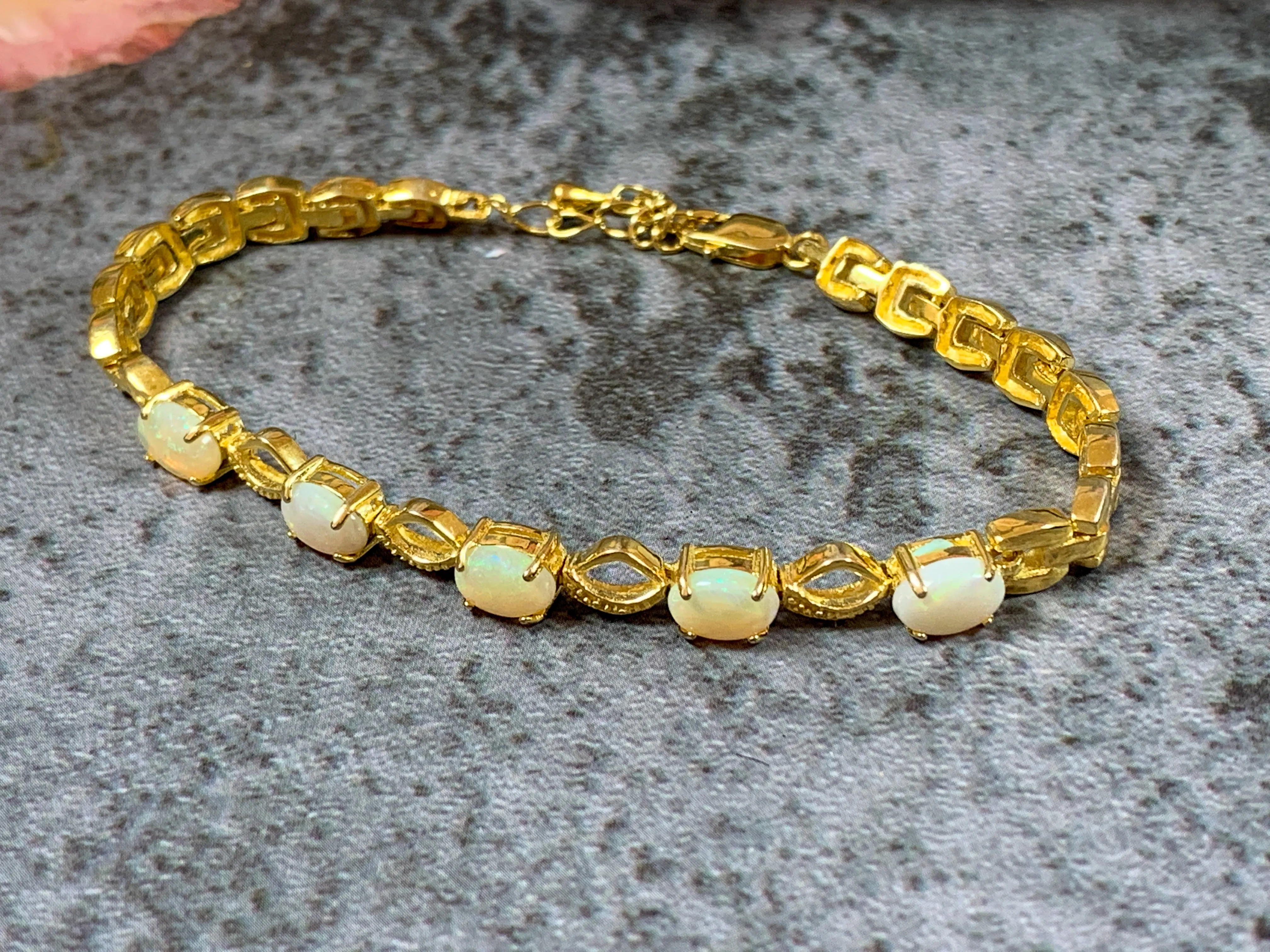 Gold Plated Sterling Silver patterned bracelet with 7x5mm White Opals