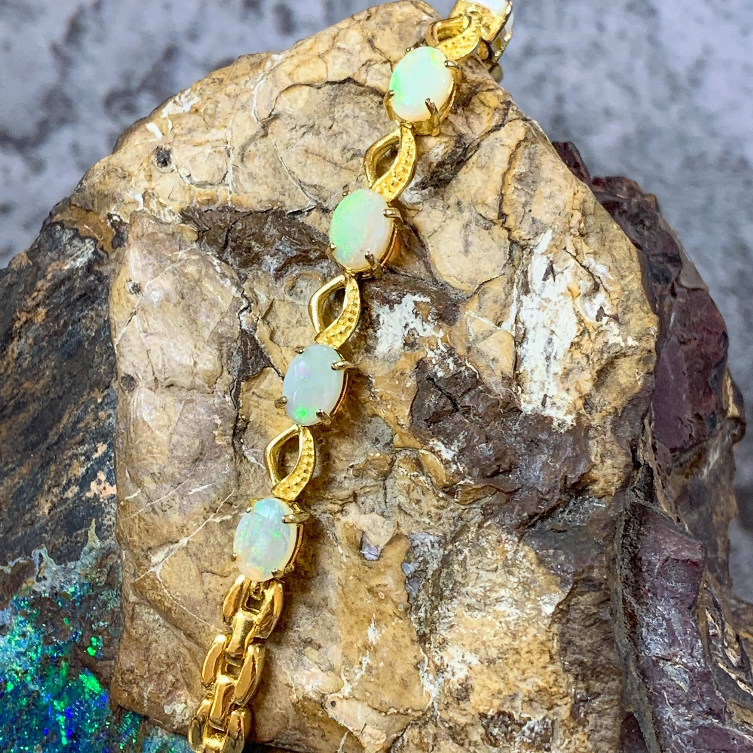Gold Plated Sterling Silver patterned bracelet with 7x5mm White Opals